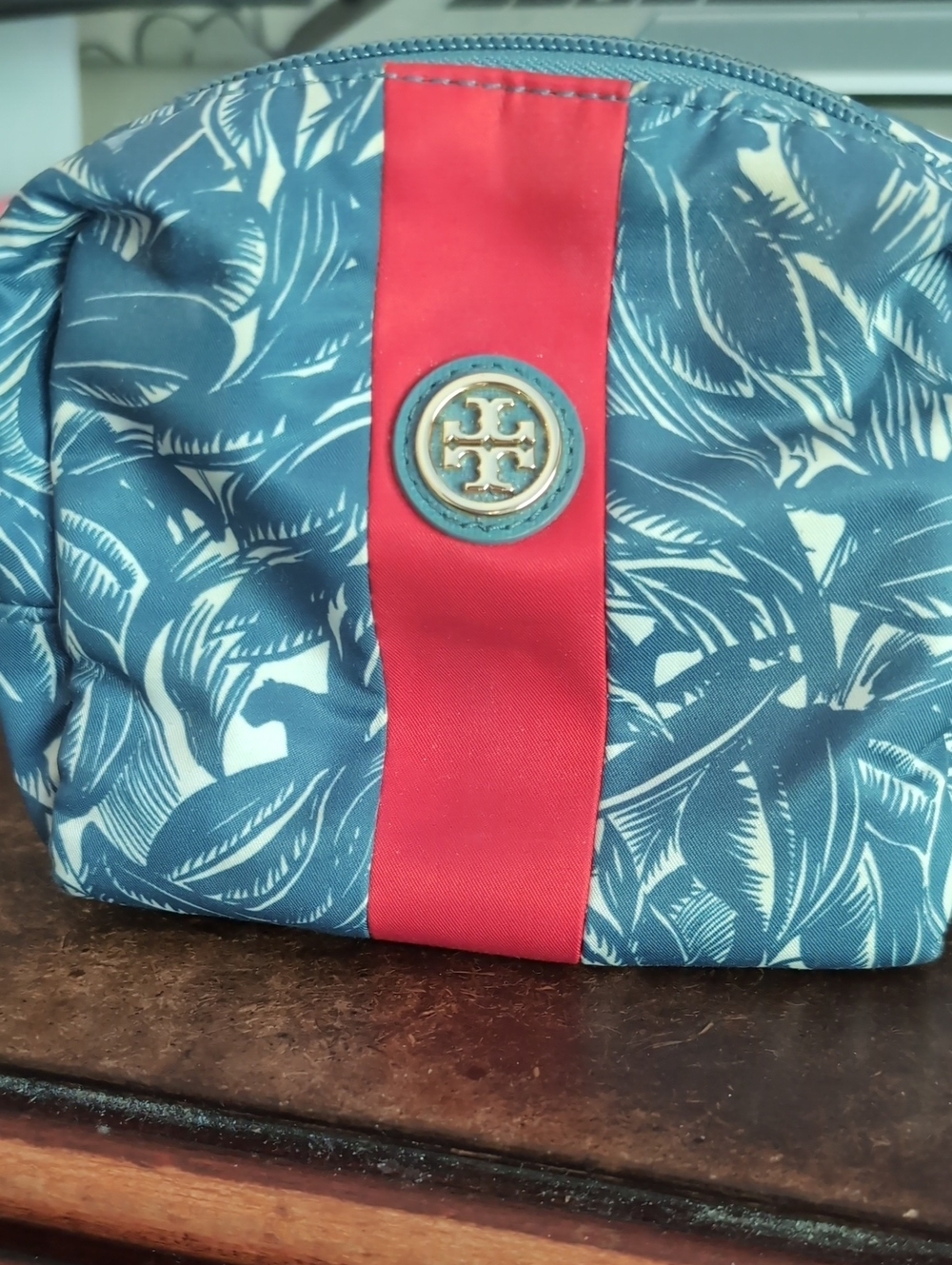 Tory Burch Navy Floral Cosmetic Pouch with Red Stripe.
